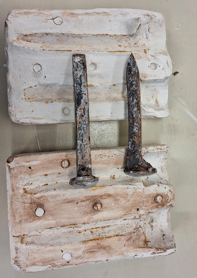 Blood on the Rails. Halloween project. 2023, slip, iron, wood, rock.